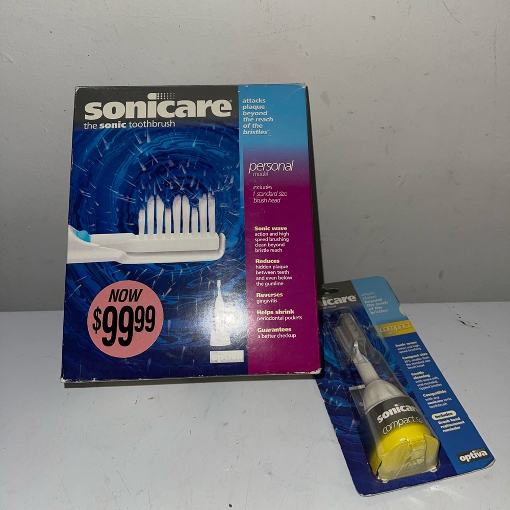 Sonicare optiva electric toothbrush with extra brush head. Open box item.